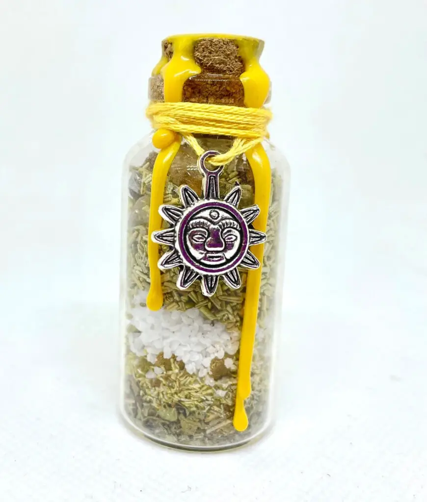 Happiness spell jar with a sun charm