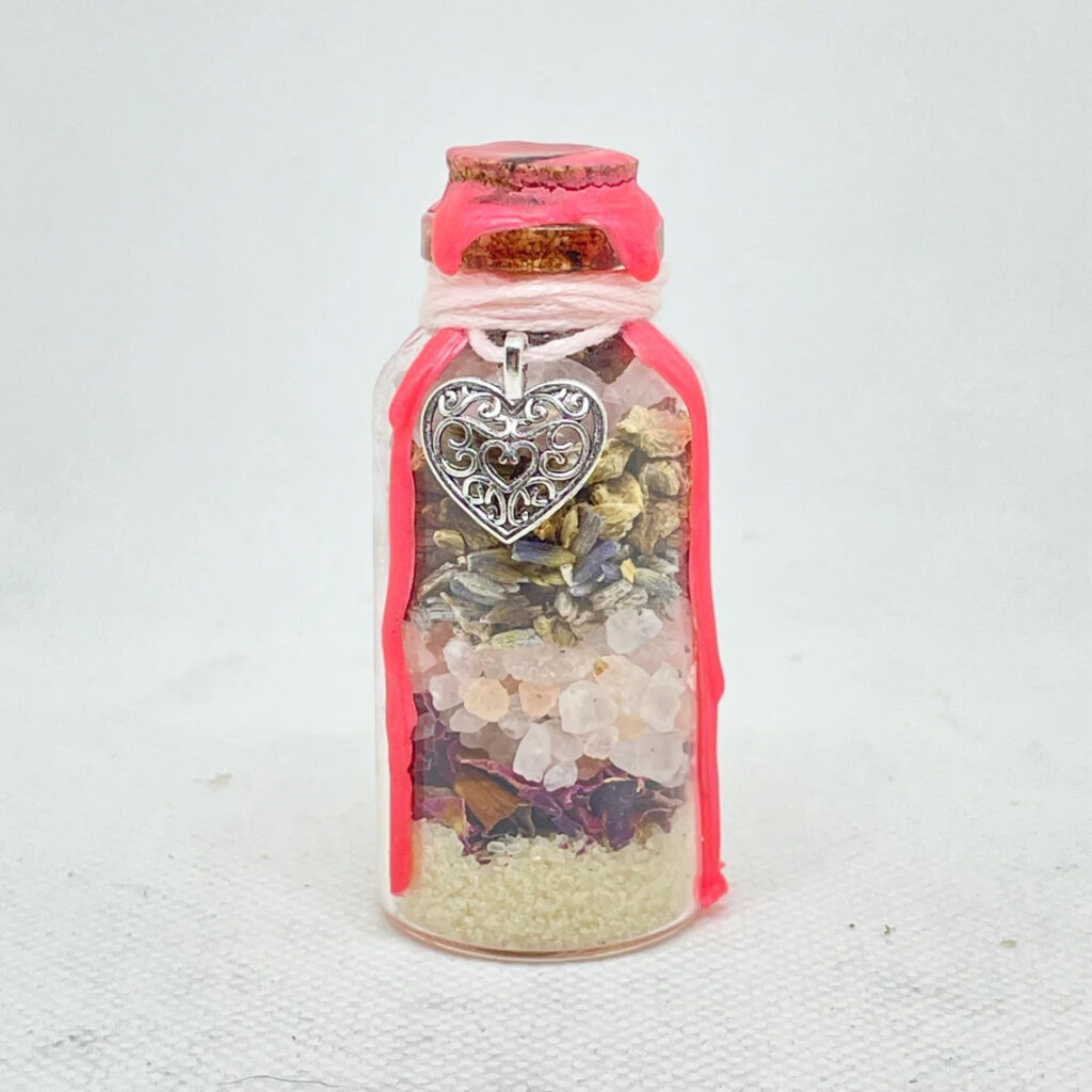 self-love spell jar with heart charm